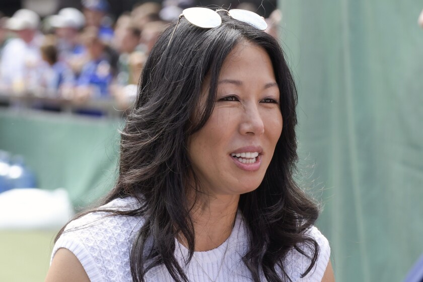 FILE - Buffalo Bills co-owner Kim Pegula speaks to a colleague before an NFL football game against the New York Jets, onSept. 8, 2019, in East Rutherford, N.J. Buffalo Bills and Sabres co-owner Kim Pegula is "progressing well" in rehabilitating from a health issue she experienced earlier this month, the family said in a statement released on Tuesday, June 28, 2022. (AP Photo/Bill Kostroun, File)