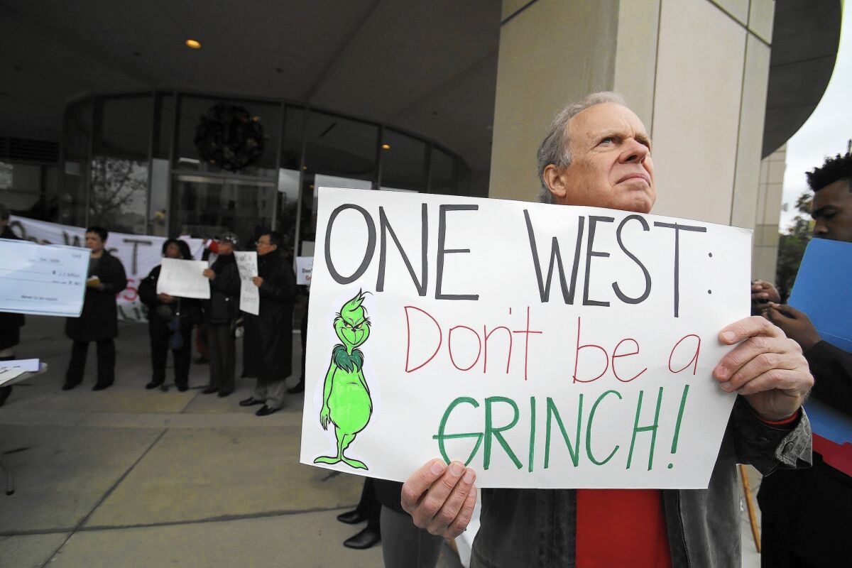 Protesters in Pasadena hold rally in December in an effort to have regulators scrutinize the $3.4-billion purchase of OneWest bank more closely.