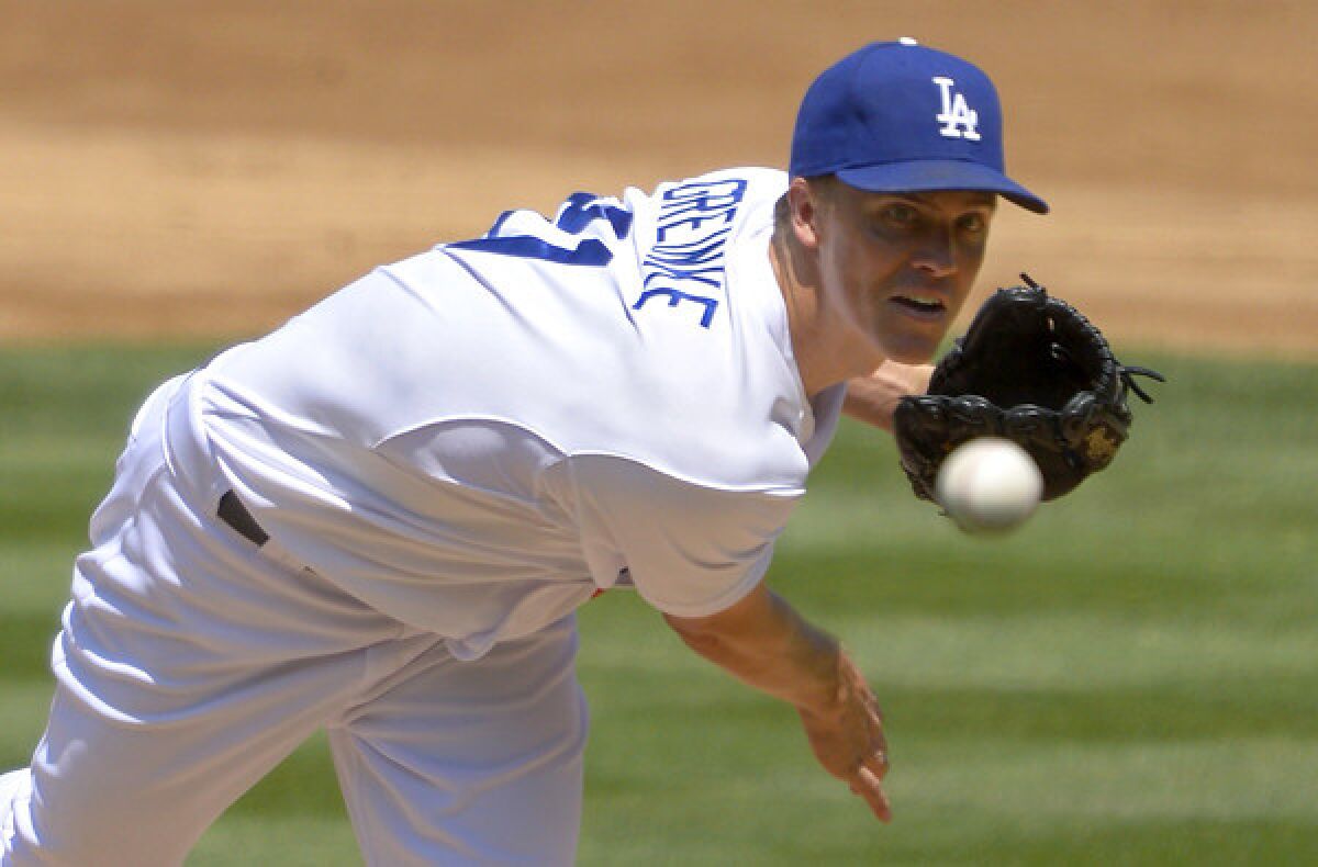 Dodgers starter Zack Greinke, pictured last August, says he could have continued pitching Thursday despite a mild calf strain.