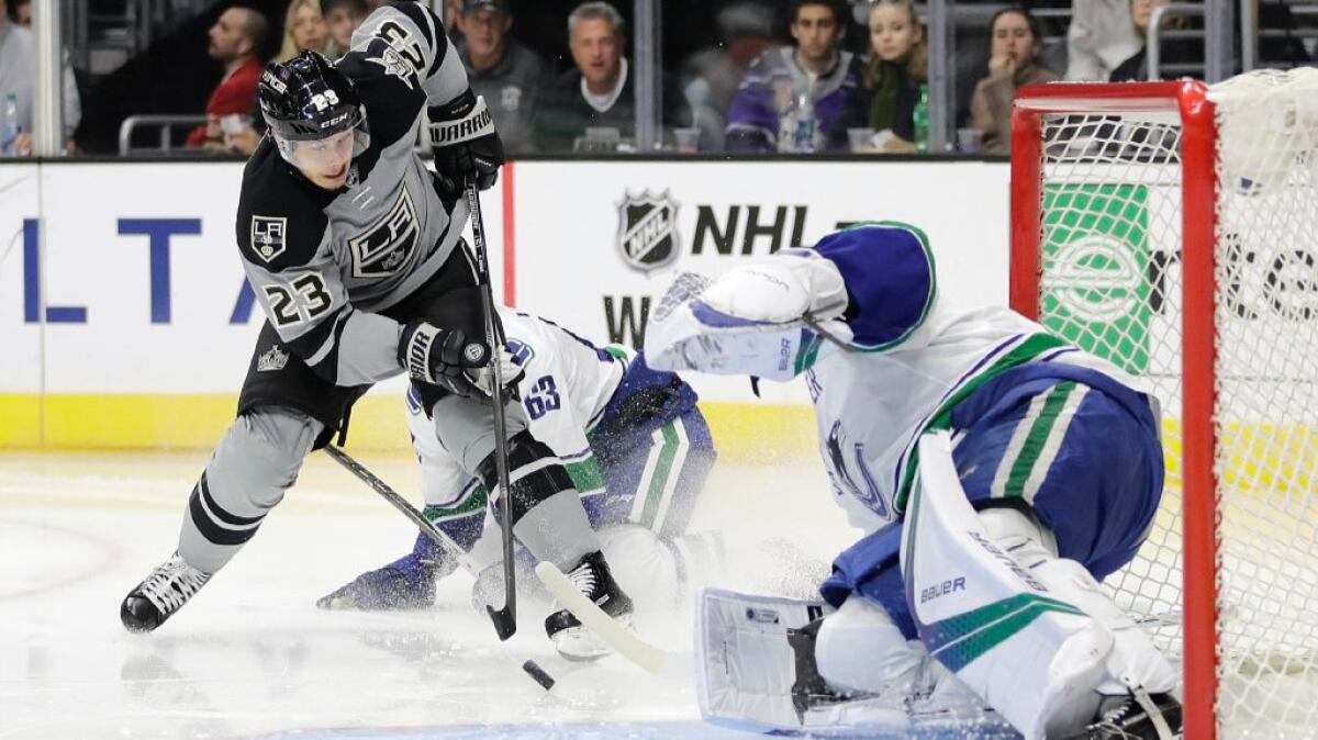 Kings forward Dustin Brown scores on Canucks goalie Jacob Markstrom during the second period of a game on Oct. 22.