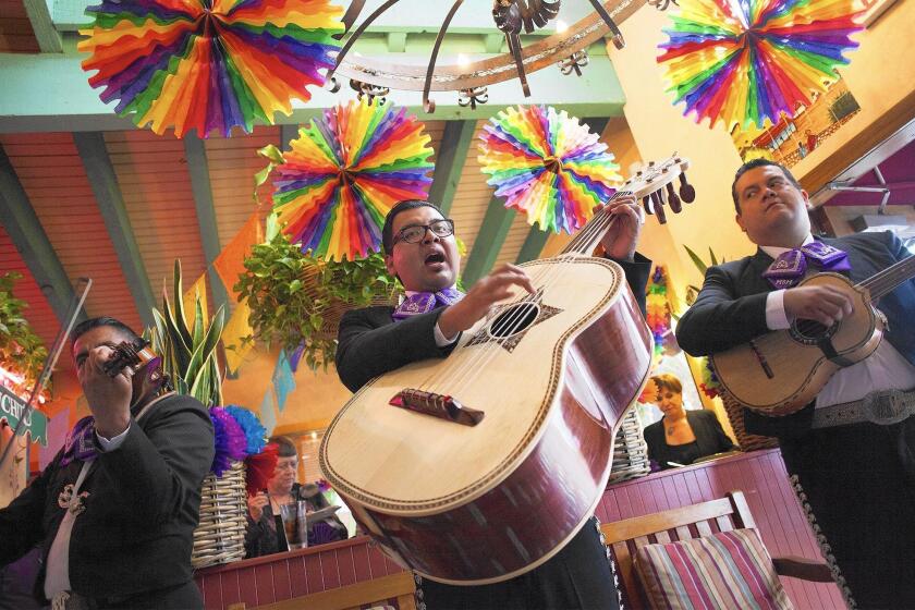 Mariachi performers entertain guests at Avila's El Ranchito restaurant in Costa Mesa.