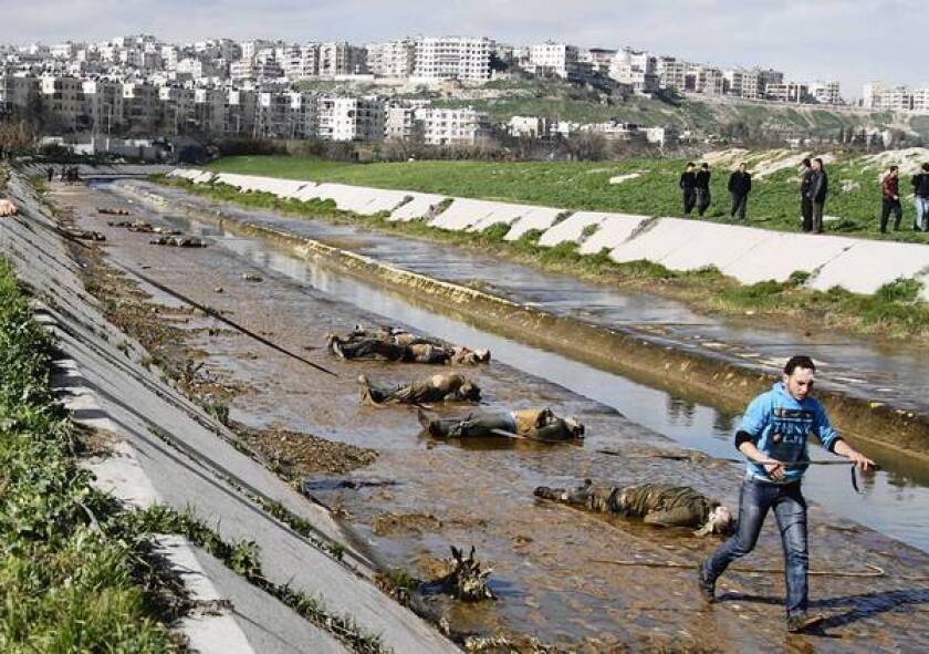 Bodies of young men, many handcuffed and with bullet holes in their heads, were found in a muddy riverbed in Aleppo, the latest atrocity in Syria for which no one has claimed responsibility.