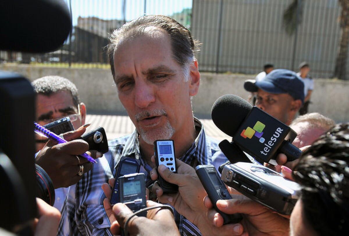 Rene Gonzalez, one of the "Cuban Five" group convicted of espionage in the United States, speaks with journalists outside the U.S. Interest Section in Havana.