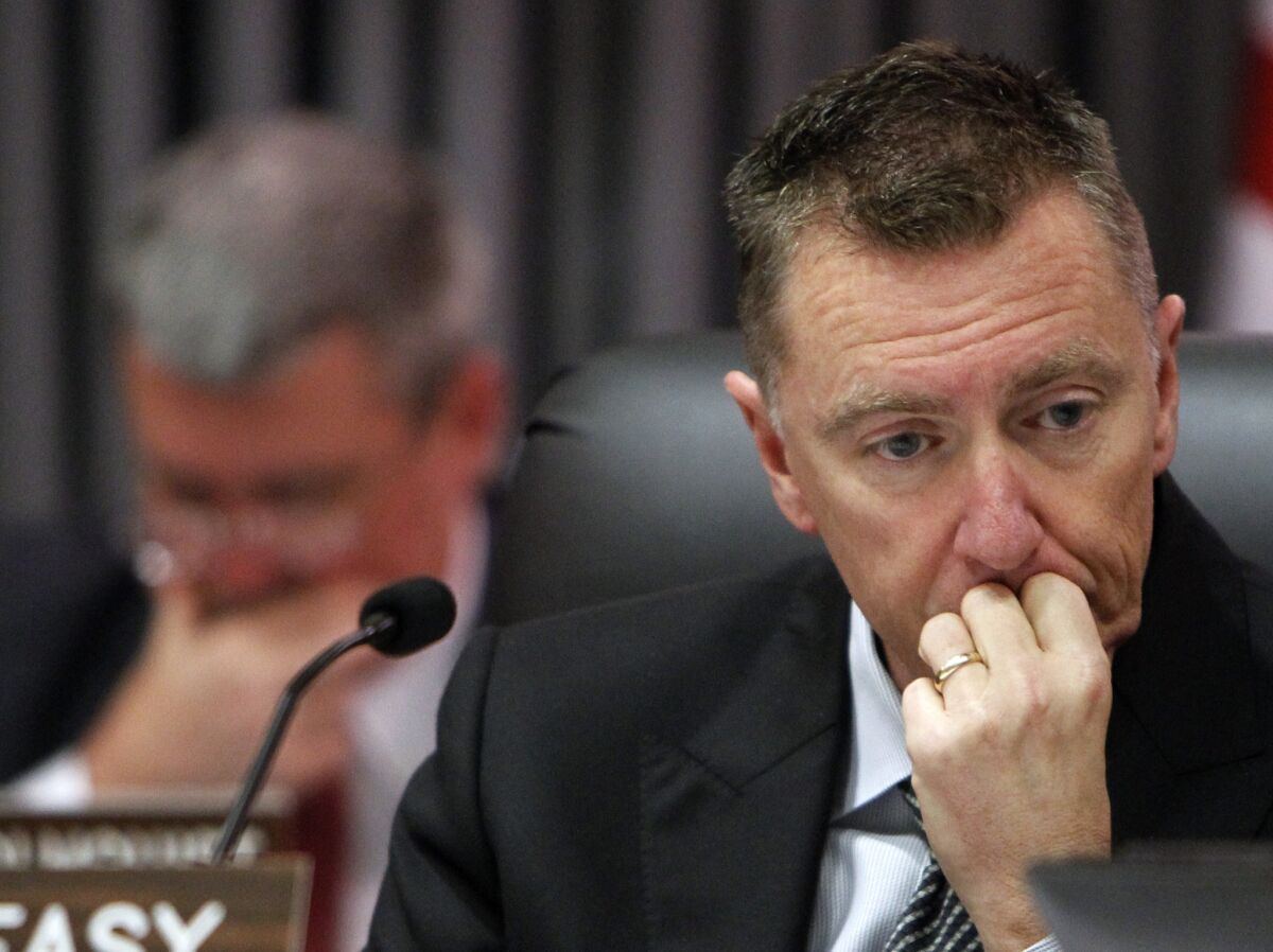 L.A. Unified Supt. John Deasy listens at a meeting. He is scheduled to have a performance review with the Board of Education.