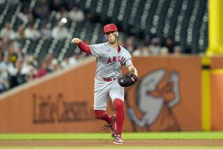 Los Angeles Angels shortstop Zach Neto throws out Detroit Tigers' Matt Vierling during the eighth inning of a baseball game, Tuesday, Aug. 27, 2024, in Detroit. (AP Photo/Carlos Osorio)