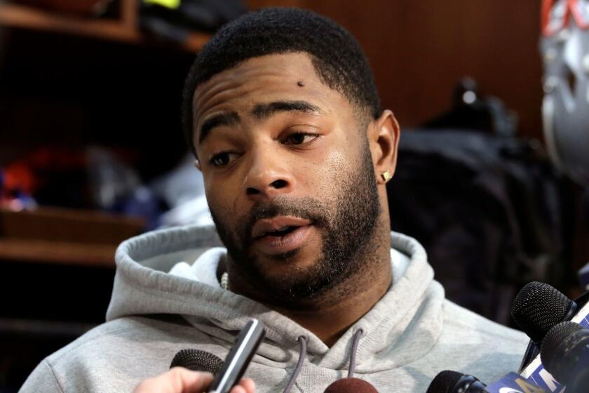 FILE - In this Jan. 25, 2018, file photo, New England Patriots cornerback Malcolm Butler takes questions from reporters in the team's locker room following NFL football practice in Foxborough, Mass. Butler said Tuesday, Feb. 6, 2018, that he didnât miss a curfew or do anything off the field that would have hurt New Englandâs chances of winning the Super Bowl before he was benched for the game. (AP Photo/Steven Senne, File)