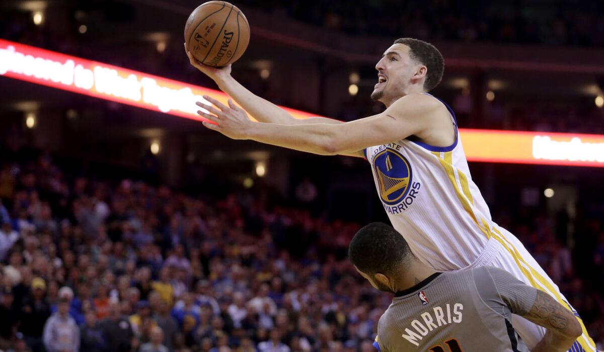 All-Star guard Klay Thompson and the Warriors continue to soar above Suns forward Markeiff Morris and the rest of the NBA.