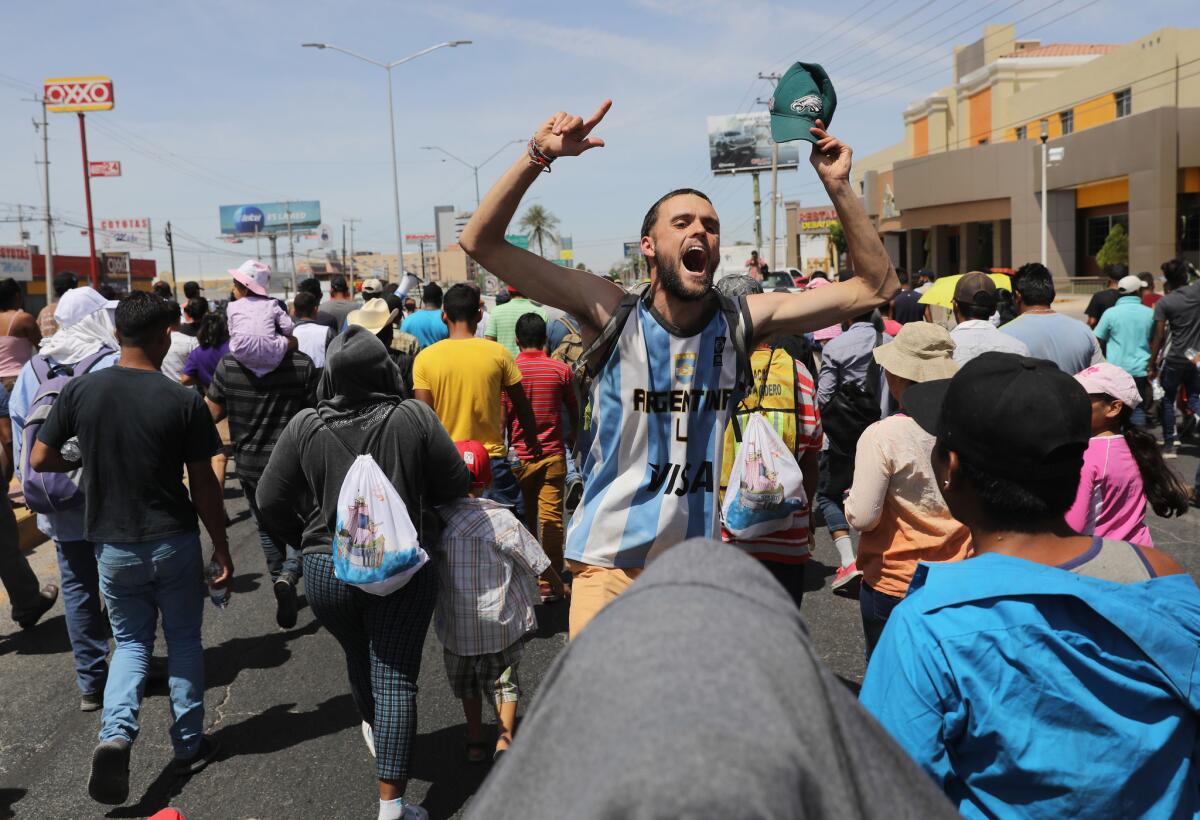 Central American immigrants, part of an immigrant "caravan," protest in Hermosillo, Mexico, against President Trump's tweets calling for U.S. Homeland Security to stop them from crossing the border into the United States to request political asylum.