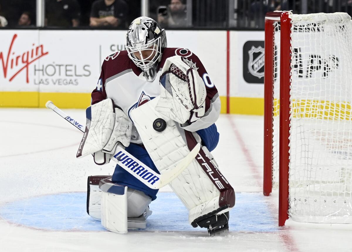 Colorado Avalanche goaltender Alexandar Georgiev stops the puck during the second period of the team's NHL preseason hockey game against the Vegas Golden Knights on Wednesday, Sept. 28, 2022, in Las Vegas. (AP Photo/David Becker)