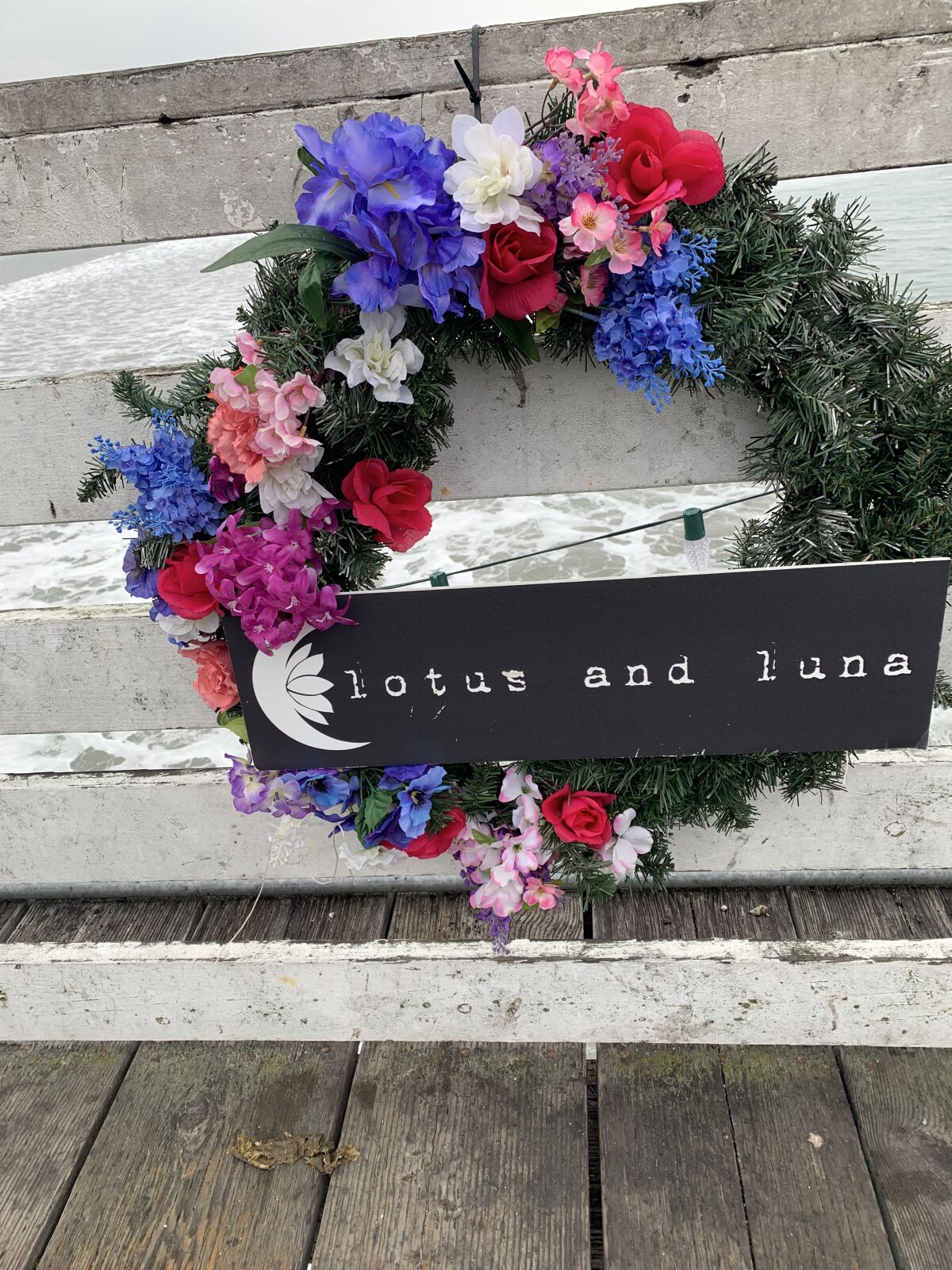 A wreath decorated by Pacific Beach clothing store Lotus and Luna.