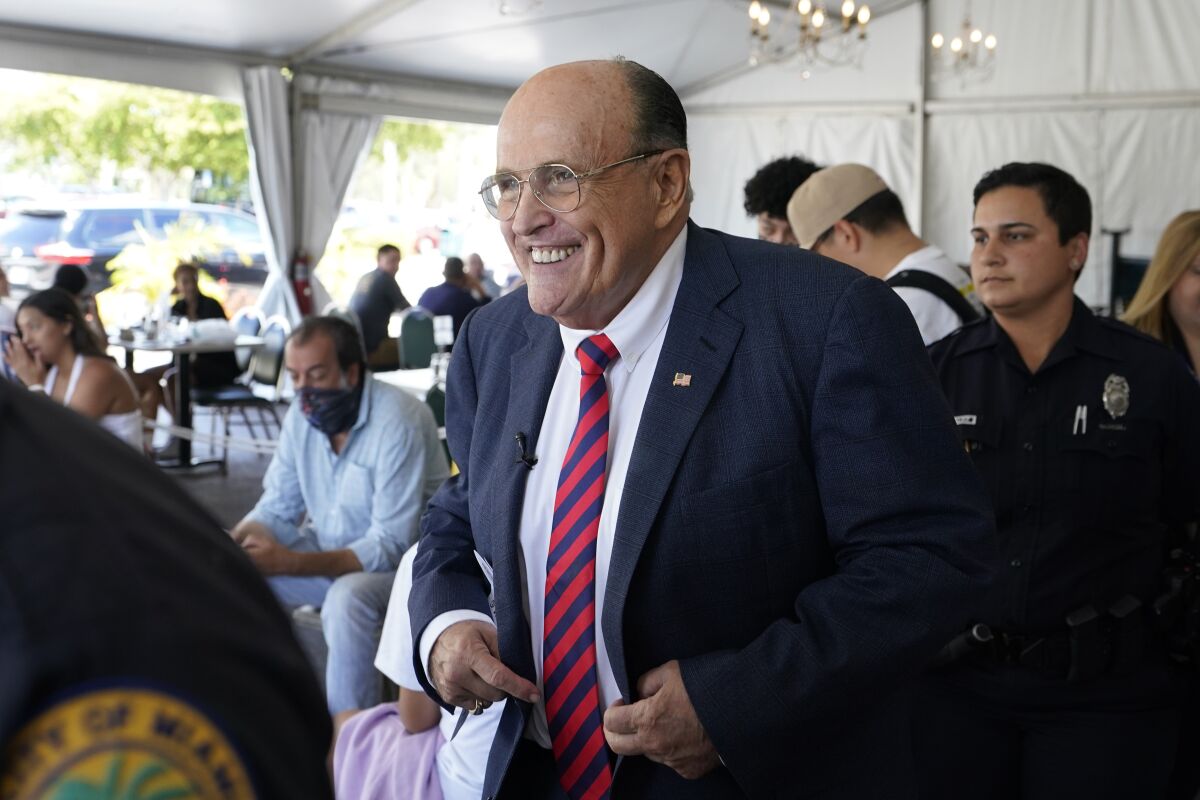 Former New York City Mayor Rudy Giuliani arrives at a news conference in support for the people of Cuba, Monday, July 26, 2021, at the Versailles Cuban restaurant in the Little Havana neighborhood of Miami. (AP Photo/Wilfredo Lee)