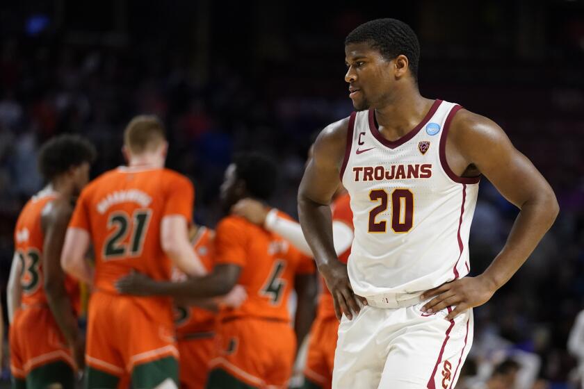 Southern California guard Ethan Anderson reacts after their loss against Miami during the second half of a college basketball game in the first round of the NCAA tournament on Friday, March 18, 2022, in Greenville, S.C. (AP Photo/Chris Carlson)