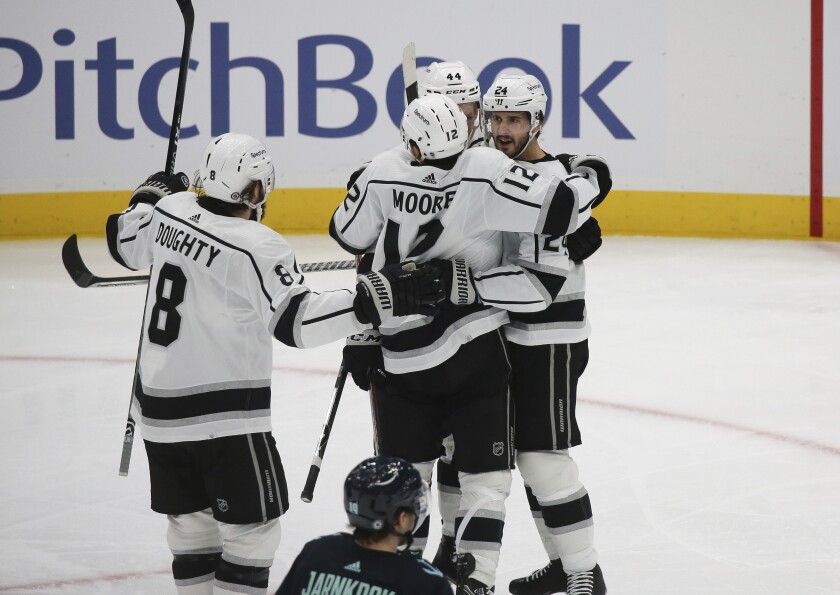 The Kings' Phillip Danault, at right, celebrates with teammates after his second-period goal Saturday night. 