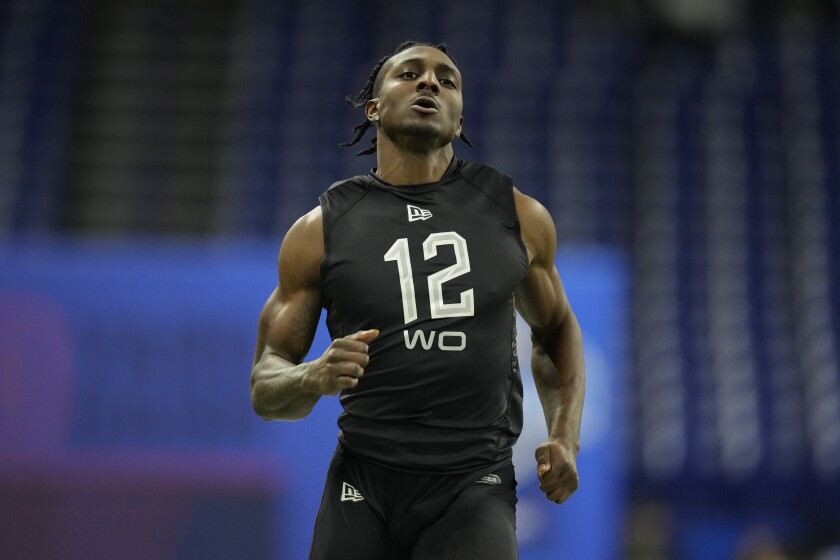 FILE - SMU wide receiver Danny Gray runs the 40-yard dash at the NFL football scouting combine March 3, 2022, in Indianapolis. San Francisco 49ers rookie receiver Gray found the ideal workout partner before the draft to prepare him to play with the 49ers' strong-armed quarterback Trey Lance. It just happened to be a former 49ers quarterback known for his his ability to throw with velocity. “I worked out with Colin Kaepernick and he has kind of like a bazooka, too," Gray said Thursday, May 12. "That workout was pretty great. So I think I’m. I think I’m up for the task.” (AP Photo/Charlie Neibergall, File)