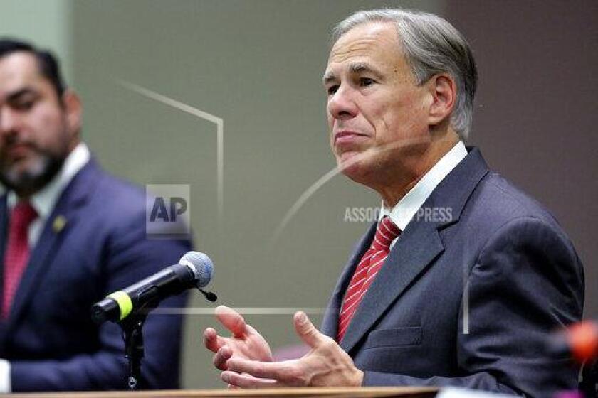 Texas Gov. Greg Abbott speaks before he signs Texas SB 576, an anti-smuggling bill that enhances the criminal penalty for human smuggling when a payment is involved, at McAllen City Hall on Wednesday, Sept. 22, 2021, in McAllen, Texas. (Joel Marinez/The Monitor via AP)