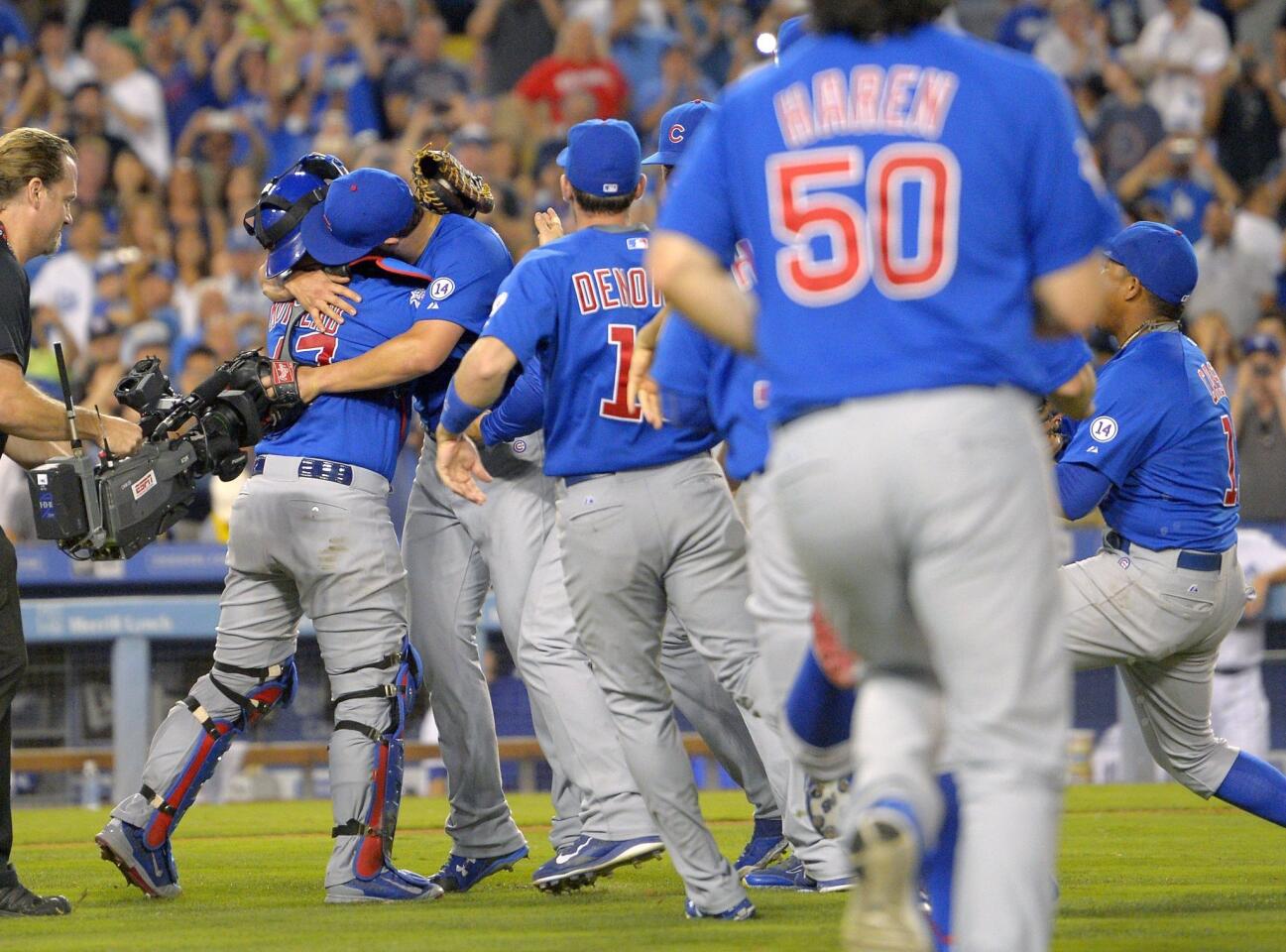 Jake Arrieta celebrates with teammates after throwing his first career no-hitter.