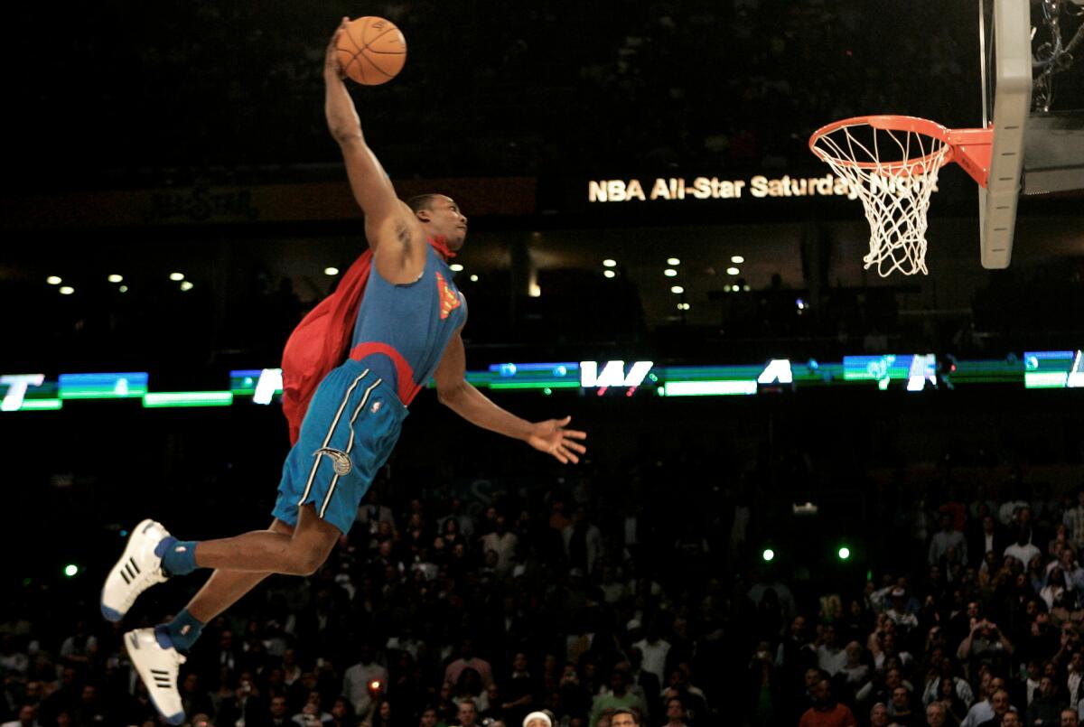 Dwight Howard soars toward the basket during the slam dunk contest at the New Orleans Arena during All-Star weekend in 2008.