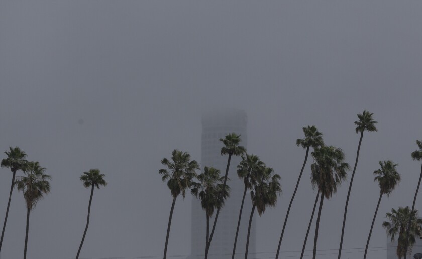 The U.S. Bank Tower, a 1,018-foot skyscraper, is seen under heavy clouds in Los Angeles on Thursday.
