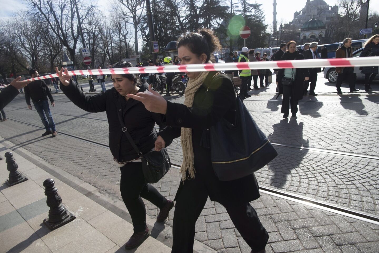 People get away from the area after an explosion near the Blue Mosque in the Sultanahmet district of central Istanbul.