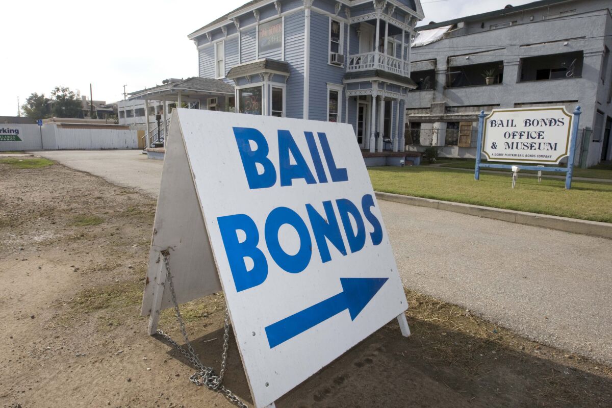 A bail bond office displays a sign near a California jail.