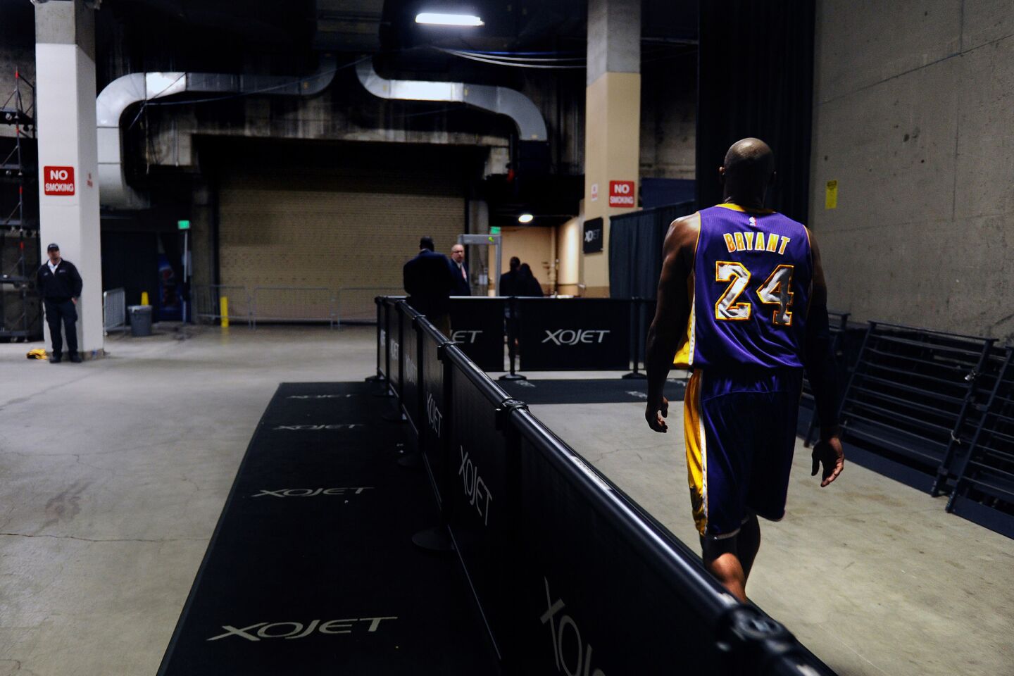 Kobe Bryant heads to the Oracle Arena locker room after the Lakers lost the Warriors, 116-98, in his final game in Oakland on Jan. 14, 2016.