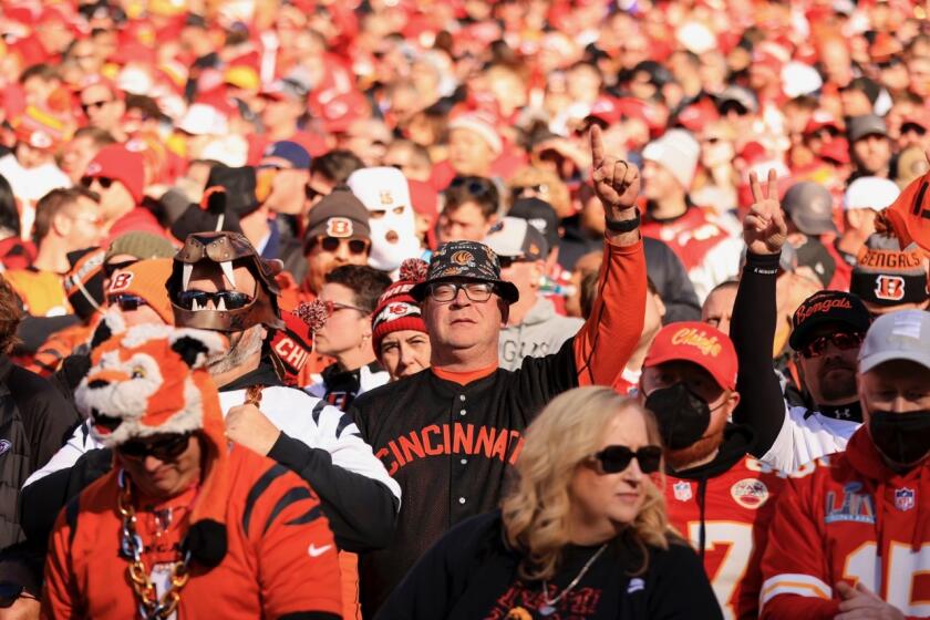 Jim Foster (center, with glasses) cheers on his Cincinnati Bengals.