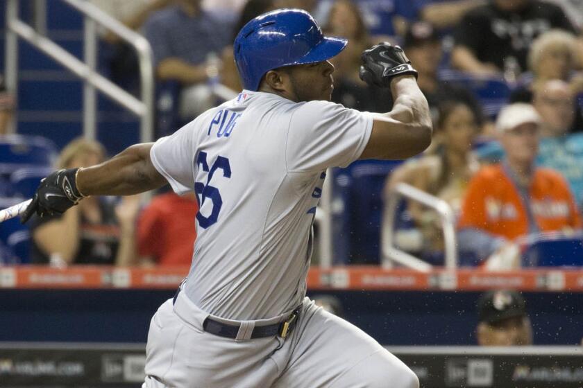Dodgers right fielder Yasiel Puig grounds out after entering the game as a pinch hitter in the eighth inning of Friday's 7-1 victory over the Miami Marlins.