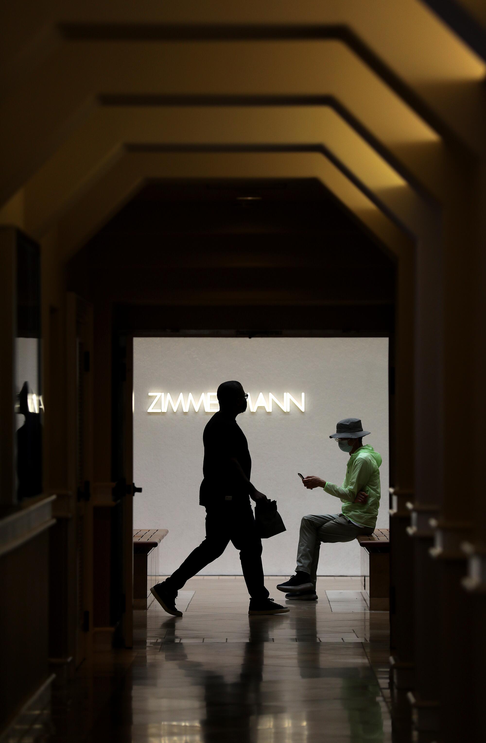 Shoppers at South Coast Plaza in Costa Mesa on Tuesday, June 15, 2021.