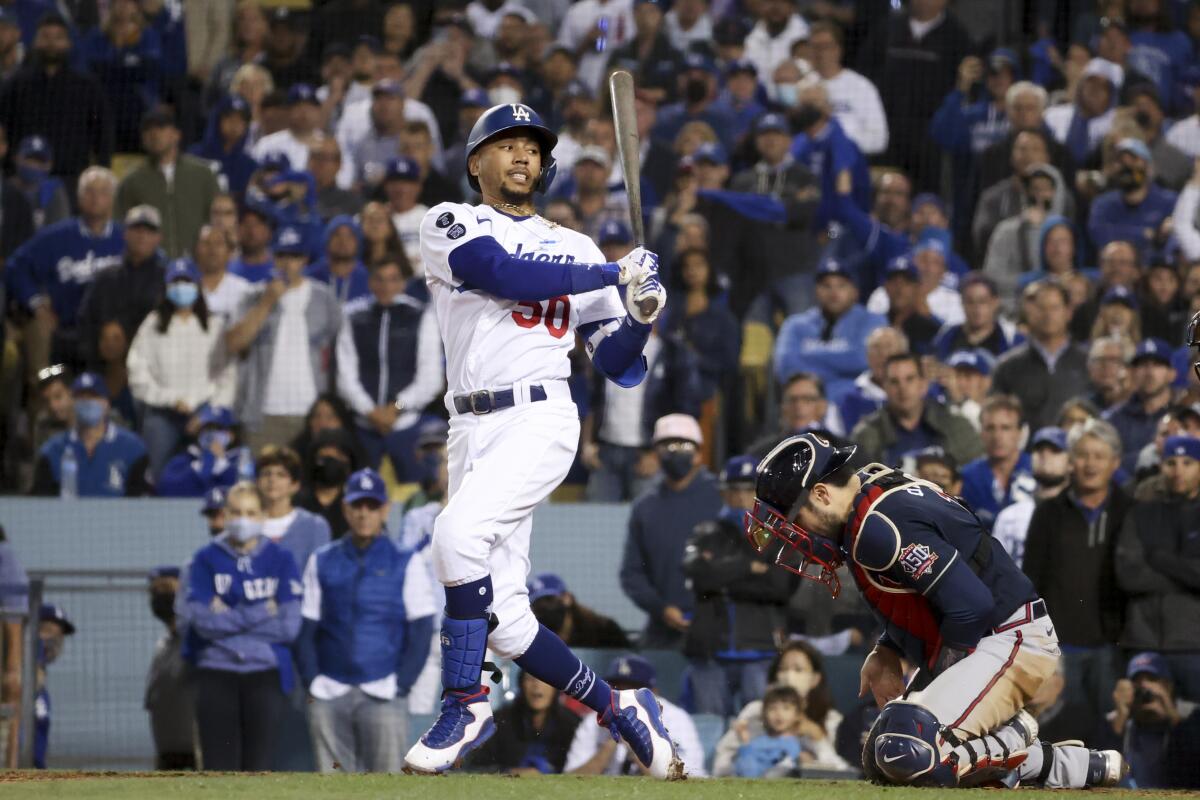 Mookie Betts looks back after striking out during the eighth inning in a 9-2 loss to the Atlanta Braves.