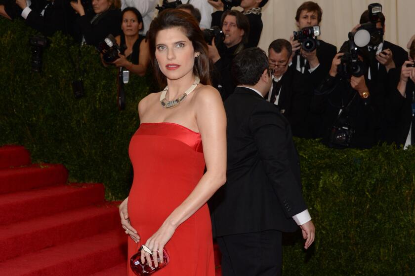 Lake Bell, who made her pregnancy public on April 23, donned a Tommy Hilfiger gown and showed off her new curves at the Metropolitan Museum of Art's Costume Institute gala on Monday night in New York City.