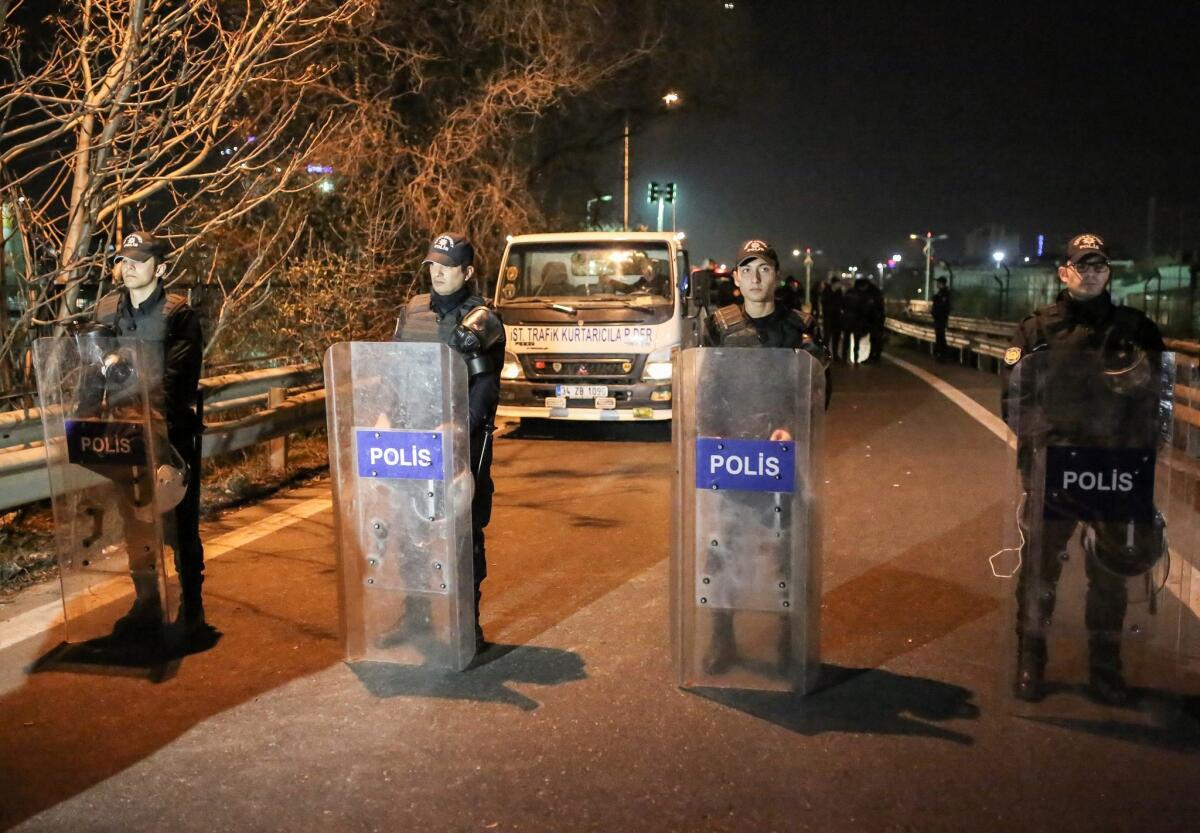 Turkish police officers stand guard near the site of an explosion on Dec. 1 in Istanbul.
