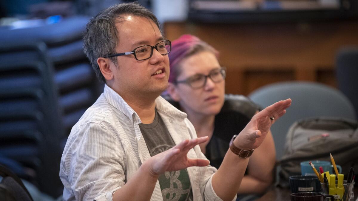 Qui Nguyen and Kimberly Colburn work with actors rehearsing the play at the South Coast Repertory.