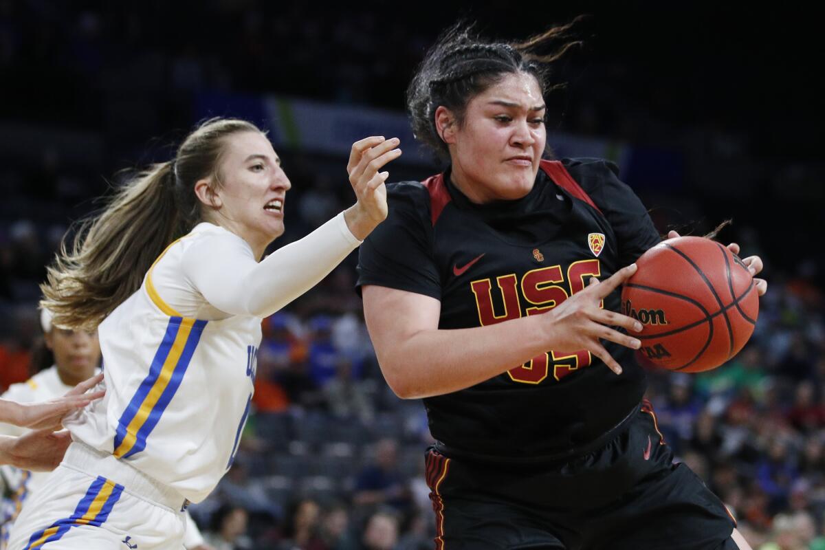 USC's Alissa Pili drives around UCLA's Chantel Horvat during Pac-12 quarterfinals on March 6.