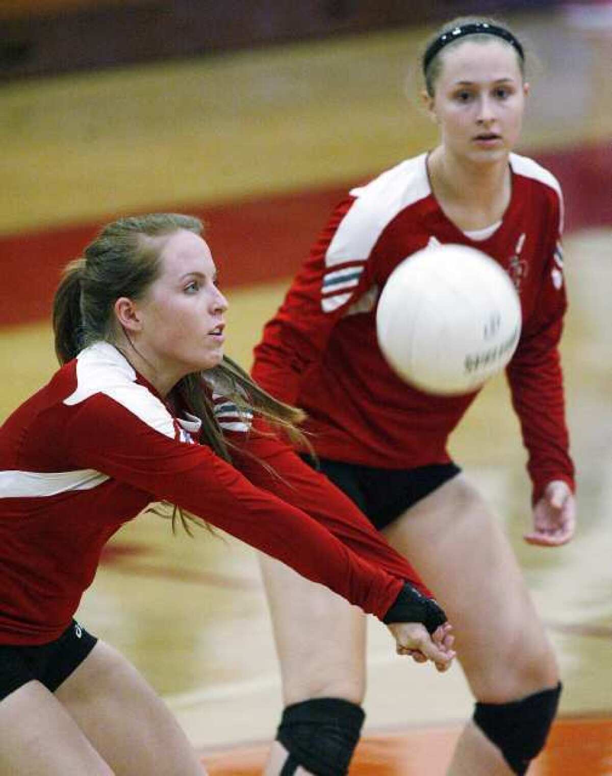 Burroughs' Tori Adams bumps a serve from Pasadena.