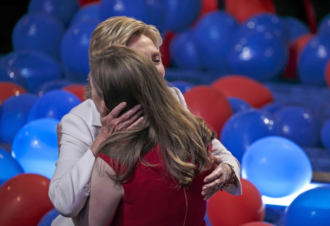 Hillary Clinton embraces her daughter, Chelsea Clinton, after wrapping up the 2016 Democratic National Convention in Philadelphia.