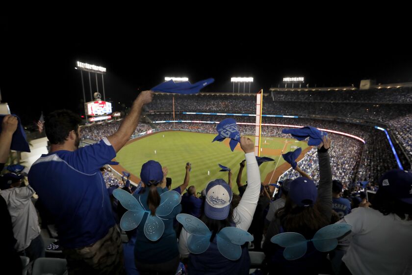 Fans celebrate as the Dodgers beat the Astros 3-1 in Game 6 of the World Series on Oct. 31 at Dodger Stadium.