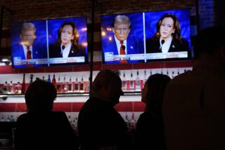 Viewers gather to watch a debate between Democratic presidential nominee Vice President Kamala Harris and Republican presidential nominee former President Donald Trump at the Angry Elephant Bar and Grill, Tuesday, Sept. 10, 2024, in San Antonio. (AP Photo/Eric Gay)