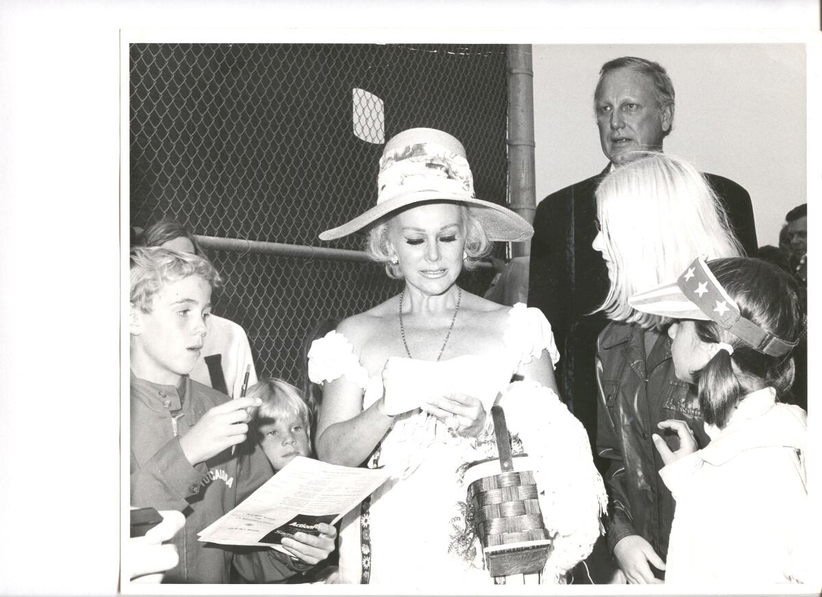 Socialite and actress Zsa Zsa Gabor signs autographs for the public at the Balboa Bay Club.
