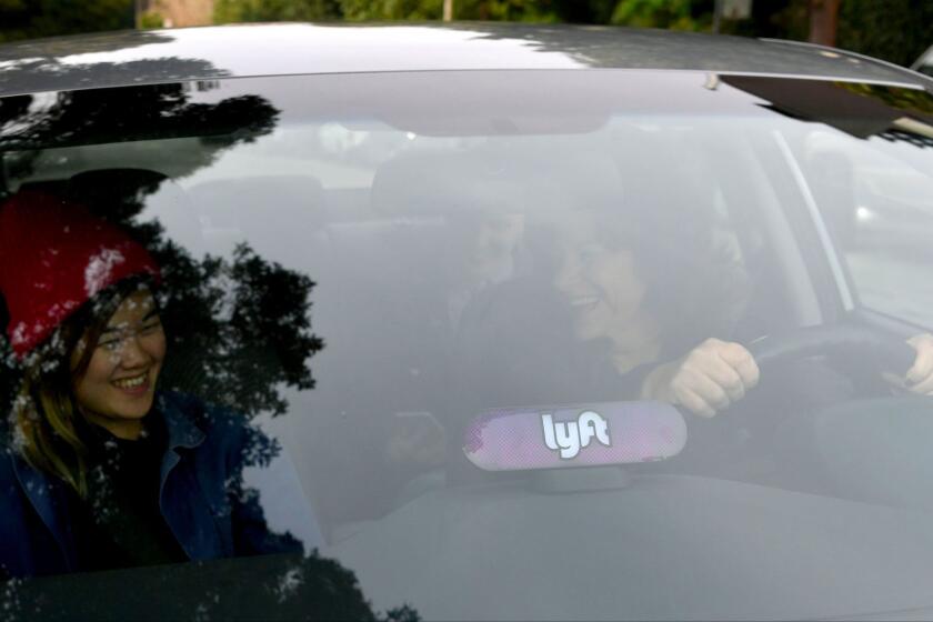 IMAGE DISTRIBUTED FOR LYFT - In this image distributed on Thursday, Feb. 9, 2017, Lyfts new Amp glows on the dashboard of a car in San Francisco.(Josh Edelson/AP Images for Lyft)