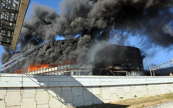 Smoke billows from a seven-story building after a small private plane crashed into it. A software engineer who had a dispute with the Internal Revenue Service was the pilot. The federal agency had offices in the building.