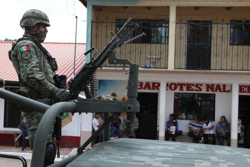 Mexican soldiers guard the place where Jesuit priests Javier Campo Morales and Joaquin Mora were murdered on June 20 in the town of Cerocahui, in the municipality of Urique, southwest of Creel, State of Chihuahua, Mexico on June 26, 2022. (Photo by HERIKA MARTINEZ / AFP) (Photo by HERIKA MARTINEZ/AFP via Getty Images)