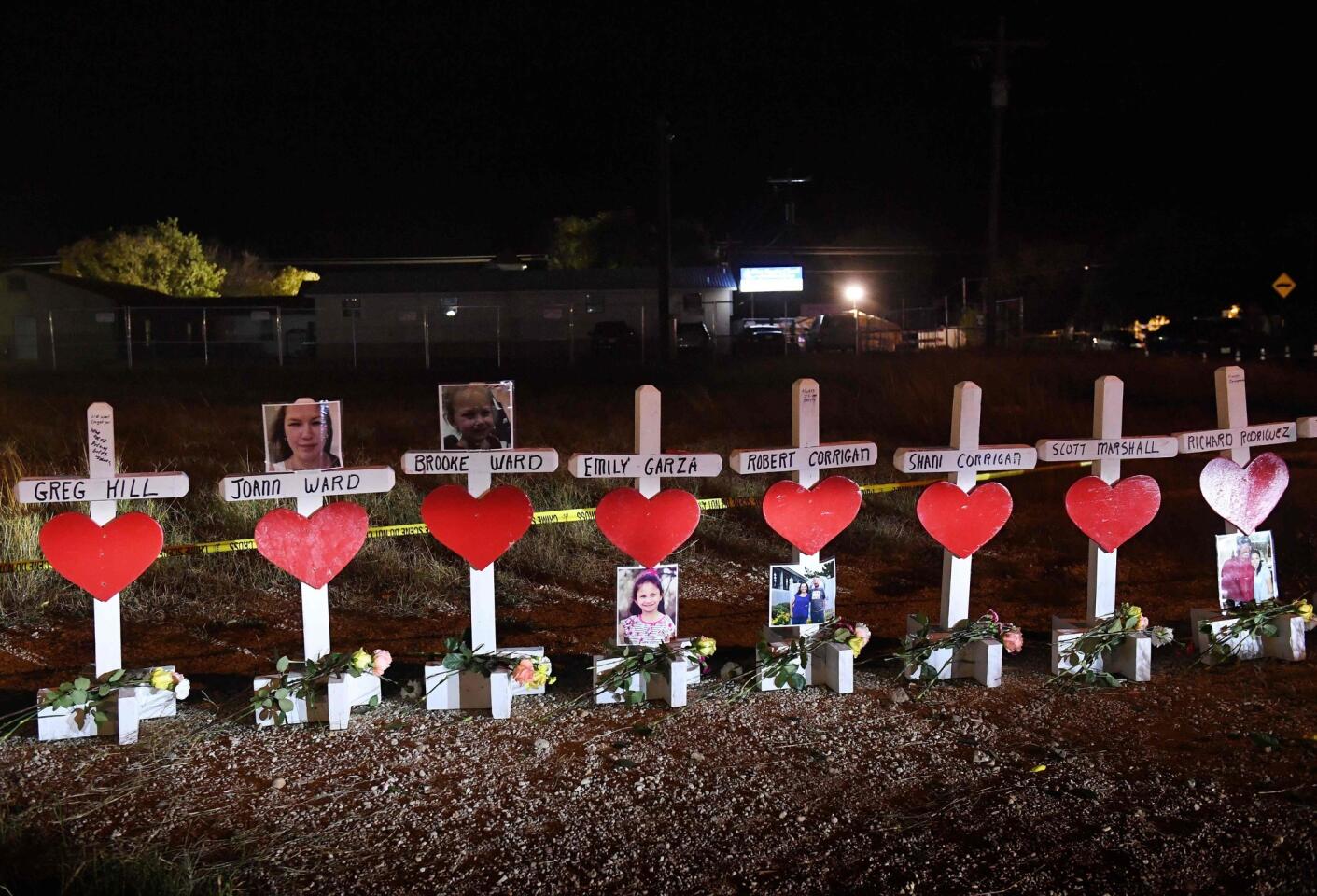 Crosses with the names of victims are seen outside the First Baptist Church, the scene of a mass shooting that killed 26 people in Sutherland Springs, Texas.