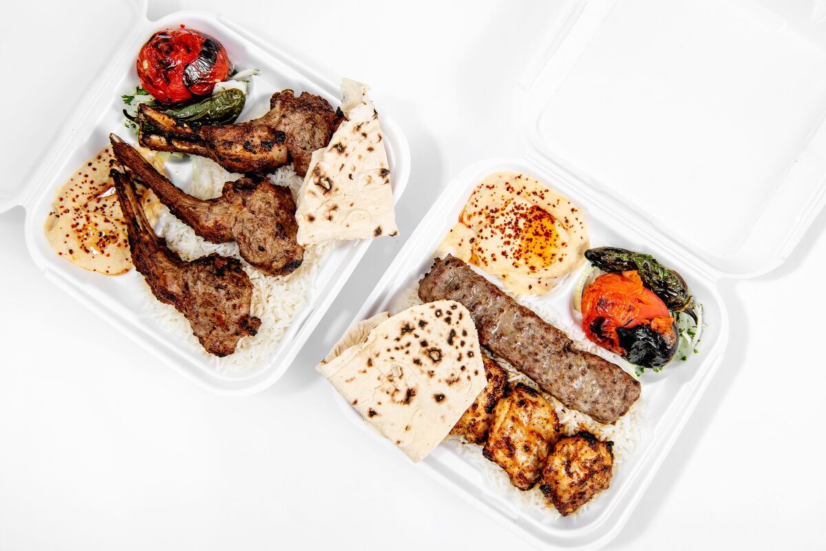 An overhead photo of lamb chops and the chicken lule kabob in white styrofoam containers