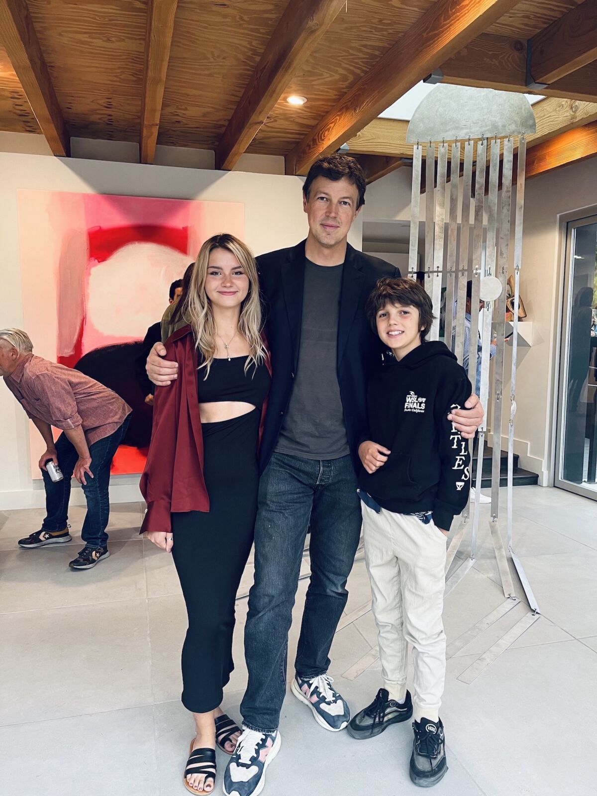 Oolong Gallery owner Eric Laine with assistant Margo Yinger and son Edgar.