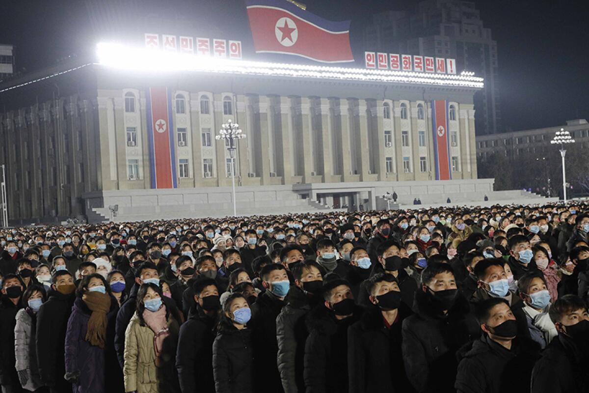 A large crowd watches fireworks, a concert and a flag-hoisting ceremony Friday in Pyongyang.
