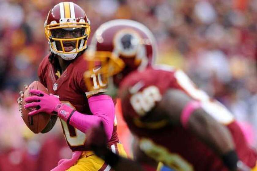 Will DirecTV pass on Sunday Ticket? Above, Redskins quarterback Robert Griffin III.