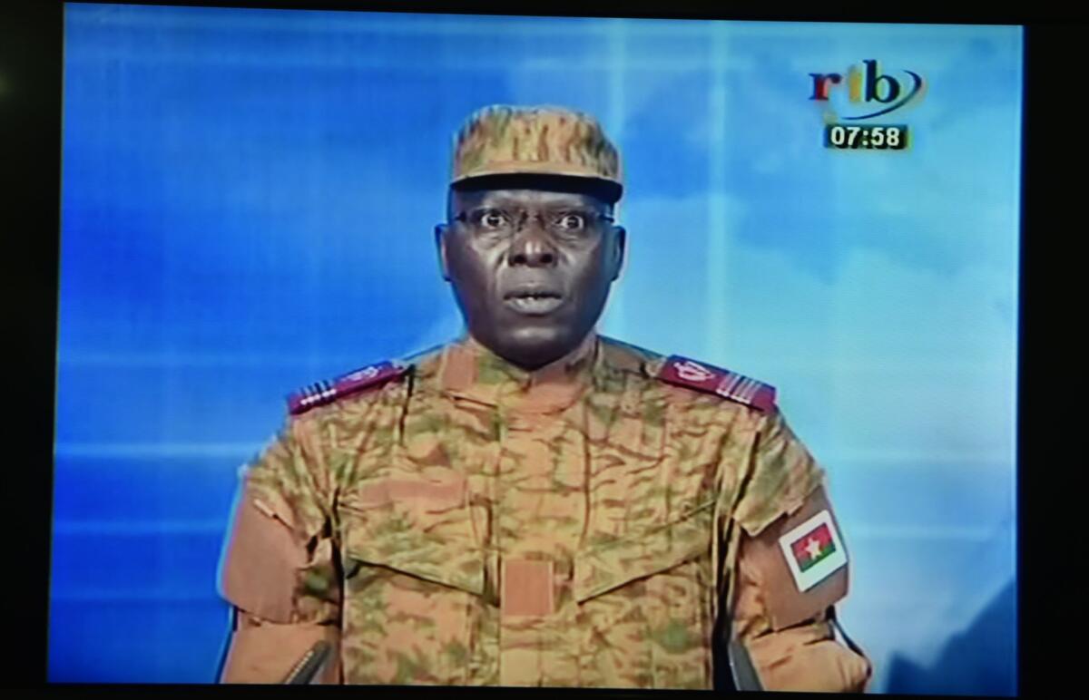 A picture taken on Thursday shows a TV screen during the broadcast of the speech of Lt. Col. Mamadou Bamba announcing that a new "National Democratic Council" had put an end "to the deviant regime of transition" in Burkina Faso.