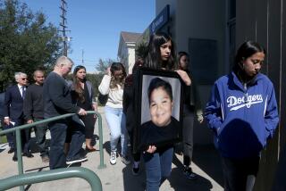 SOUTH GATE. , CALIF. - FEB. 13, 2023. Family members carry a picture of Isaiah Rodriguez, who was killed when the car he was in collided with the vehicle of an off-duty cop. Los Angeles County Sheriff's Deputy Ricardo Castro is accused of speeding in his pickup truck on Nov. 3, 2021, when he T-boned a car turning left at an intersection, killing the 12-year-old boy. ikilling Isaiah Rodriguez . (Luis Sinco / Los Angeles Times)