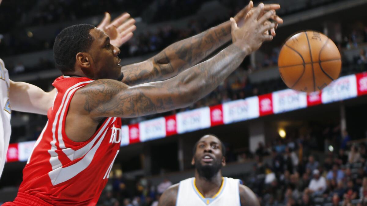 Houston Rockets forward Tarik Black chases after a rebound during a game against the Denver Nuggets on Dec. 17, 2014.