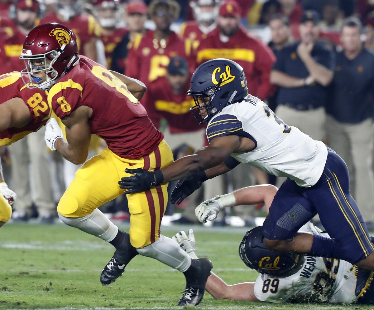 USC wide receiver Amon-Ra St. Brown fights for extra yardage against California in the second quarter on Saturday.